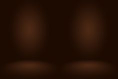 an abstract dark brown background with light spots