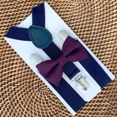 Your special guy will look so handsome when he shows up wearing this fine-looking plum purple bow tie and navy suspenders! This bow tie & suspender set is a great choice for family photos, wedding, ring bearer outfit, birthday celebration or any other special occasion. ❤ **Please Specify** Bow Tie Only (w/ Clip or Neck Strap), Suspenders Only, or Bow Tie Only & Susp (Bow Tie and Suspenders) SUSPENDERS- One Pair of our Quality Suspenders BOW TIE - One Bow Tie on White Adjustable STRAP or Wedding Ring Bearer Outfit, Tie And Suspenders, Purple Bow Tie, Wedding Ring Bearer, Gentlemen Wear, Baby Bowtie, Outfit Birthday, Bearer Outfit, Bowtie And Suspenders