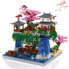 a lego model is shown with flowers and trees