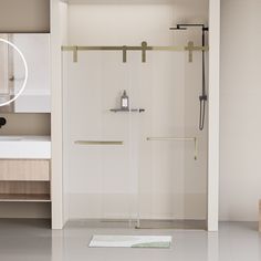 a bathroom with a shower, sink and mirror