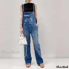 Olivia Mark - Vintage Multi-Pocket Workwear Overalls with Straight-Cut Leg, Split Hem, and Denim Straps. Utility Style Washed Blue Denim Jumpsuit, Blue Washed Denim Utility Jumpsuit, Blue Washed Denim Jumpsuit In Utility Style, Blue Denim Jumpsuit With Pockets, Casual Blue Denim Jumpsuit With Pockets, Utility Washed Blue Denim Jumpsuit With Pockets, Utility Denim Jumpsuit In Washed Blue With Pockets, High Rise Denim Jumpsuit With Pockets In Utility Style, Utility Dark Wash Denim Jumpsuit With Pockets