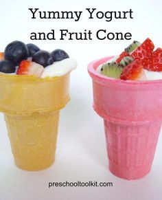 two ice cream cones filled with fruit and yogurt