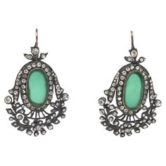 These elegant and stately vintage pierced Czech dangle earrings are rhodium plated, rhinestone interspersed, silver, and green glass. They are from the 50's or earlier and have been in our archives for over 30 years. They have an art deco style. They are dressy, dramatic and a show stopper. The green glass is an emerald color. There are no marking that we can see or that the camera picked up. Great for formal wear, charity functions or a lovely night out on the town.Measurements are approx. 3" H Emerald Color, Estilo Art Deco, Pierced Earrings, Vintage Rhinestone, Art Deco Style, Deco Style, Vintage Stil, Green Glass, Earings Piercings