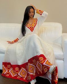 This Habesha Kemis, a traditional Ethiopian garment, radiates beauty and elegance, reflecting the rich cultural heritage and craftsmanship of Ethiopia. This exquisite dress showcases a perfect harmony of handwoven fabric, intricate embroidery, the use of Menen fabric, lightweight cotton, and quality thread, creating a stunning ensemble that captivates the eye and the heart. At the core of the Habesha Kemis lies the handwoven fabric, a testament to the skill and dedication of Ethiopian weavers. U Traditional Long Handloom Dress, Traditional Pattern Embroidered Maxi Dress For Ceremonies, Traditional Drape Dresses With Woven Motifs For Eid, Traditional Embroidered Maxi Dress For Ceremonies, Eid Dresses With Traditional Drape And Woven Motifs, Floor-length Dresses With Traditional Patterns For Ceremonies, Bohemian Dresses With Woven Motifs For Festive Season, Bohemian Festive Dress With Woven Motifs, Festive Bohemian Dress With Woven Motifs