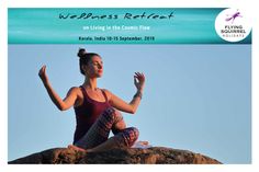 a woman sitting on top of a rock with her hands up in the air while doing yoga