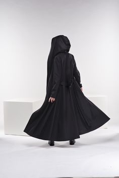 "We have stepped it up with our new winter hooded coat. It's gorgeous, inspiring, breathtaking, chic, and classic but still modern. Featuring a comfortable hood, two side pockets, and a long belt, this black swing coat really captures the DNA of our brand. The model in the picture is 170cm. ⅼ 5.7 ft. tall and is wearing size XS / Color: Black 🌟 INFO: * Worldwide EXPRESS shipping - please provide a phone number for shipping documents * US Sizing XS to 4XL - body size chart available below * We o Edwardian Coat, Mode Mantel, Hooded Wool Coat, Boho Plus Size, Winter Princess, Princess Coat, Wool Hoodie, Hooded Winter Coat, Long Knit Cardigan