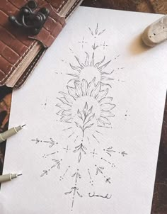 a white paper with a drawing of a flower on it