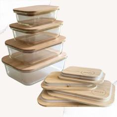 a stack of glass containers with wooden lids