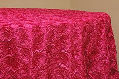 a red table cloth with an intricate design on it