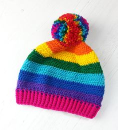 Bright rainbow striped crochet bobble hat with multicoloured pom pom. Bright Rainbow Striped Pom Pom Beanie by VelvetVolcano Cheap Multicolor Crochet Beanie, Rainbow Beanie, Colourful Fashion, Rainbow Hats, Crocheting Patterns, Bobble Hat, Bobble Hats, Bright Rainbow, Hat Crochet