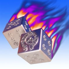 two metal dices sitting on top of each other in front of a blue background