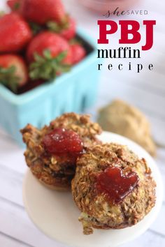 two muffins on a plate with strawberries in the background and text overlay that reads pbj muffin recipe