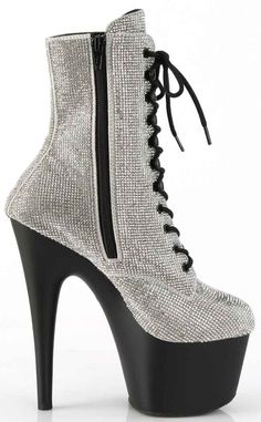 Sparkle, baby! These boots are covered in silver rhinestones, standing out against the black 7" (178mm) heel and 2 3/4" (70mm) platform. They secure with a lace up and a handy side zip. HEEL/PLATFORM : 7" Heel, 2 3/4" PFFIT GUIDE : True to sizeVEGAN : YesSIZE: US women's sizing Pleaser Shoes, Colorful Rainbow, Black Platform, Silver Rhinestone, Black 7, Womens Heels, Side Zip, Black Boots, The Black