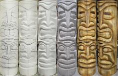 four different types of carved wooden objects in varying shapes and sizes, all lined up against one another