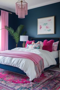 a bedroom with blue walls and pink accents