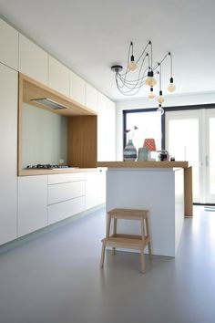 the kitchen is clean and ready to be used for cooking or eating, with an island in the middle