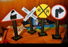 various road signs are displayed on a table