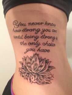 a woman's back with a tattoo saying you never know how strong you are