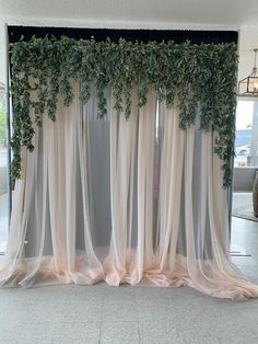 the curtains are covered with vines and flowers