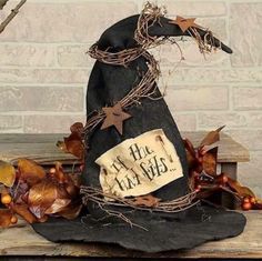 a witches hat sitting on top of a wooden bench