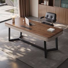 an office desk with a laptop on it in front of a bookcase and window