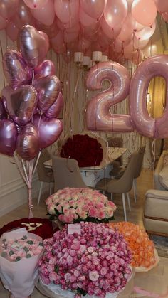 balloons and flowers are on display at the new year's eve celebration in this room