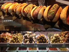 several different types of sandwiches and salads on display