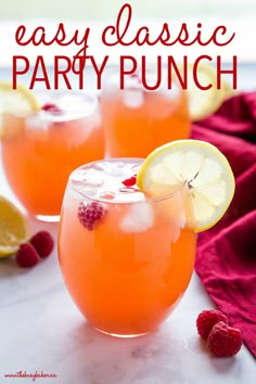 easy classic party punch with raspberries and lemons on the rim in glasses