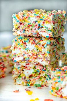 sprinkle rice krispy treats stacked on top of each other with colorful sprinkles