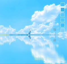 a man standing on the edge of a body of water with clouds in the background