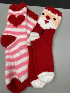 two red and white socks with hearts on them