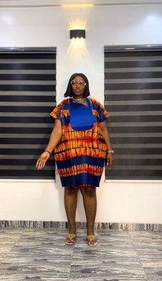 100% cotton. Made with high quality  African Ankara fabric. Short danshiki Ankara dress with phoenix embroidery.  See photo for measurements. Ready made dresses. The vibrant colors and detailed embroidery make it a standout piece in your wardrobe. Pair it with your favorite accessories for a stunning look that's sure to turn heads. Handcrafted with care, this piece is a must-have for any fashion-forward individual. Order yours today and make a statement with this unique and stylish danshiki. Lux Fitted Multicolor Short Sleeve Kaftan, Ankara Shift Dress, Phoenix Embroidery, Styles Ankara, African Party Dresses, Best African Dresses, African Wear Dresses, African Print Dress Designs, Female Shorts