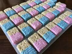 there are many cookies that have blue and pink frosting on top of each other