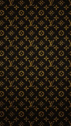 an old wallpaper pattern with gold and brown designs on black background, including the letter g