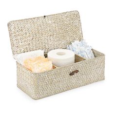 a wicker box with tissue, toilet paper and other items in it