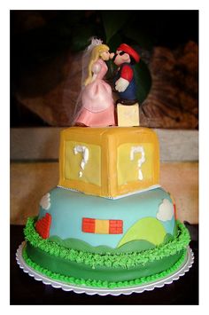 there is a cake that looks like mario and princess peaches on top of each other