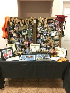 a table with pictures and graduation caps on it