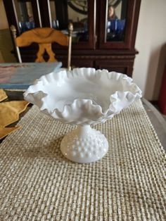 a white bowl sitting on top of a table