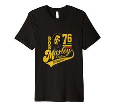 bob marley tribute t - shirt with the name bob marley in gold and black on it