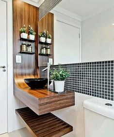 a bathroom with a sink, toilet and bathtub in it's own space