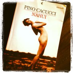 a naked man is standing in front of a book titled pino cauccici nauh