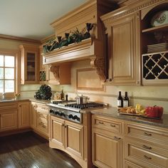 a kitchen filled with lots of wooden cabinets