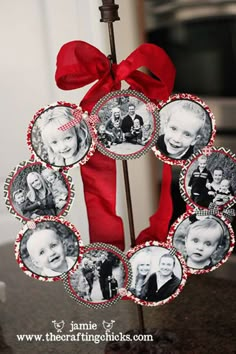 a red ribbon is tied to a wreath with pictures on it