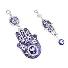 two key chains with hamsa and evil eye charms on each one, both decorated with swaro beads