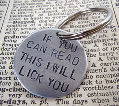 a metal keychain that says if you can read this i will lick you