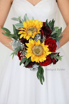 a bridal bouquet with sunflowers and red roses in the bride's hand