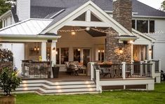 a house with lights on the front porch