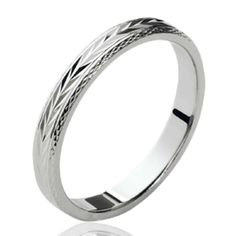 a white gold wedding ring with an intricate design