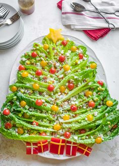 a christmas tree made out of lettuce on a plate