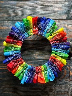 a wreath made out of candy bars on top of a wooden table